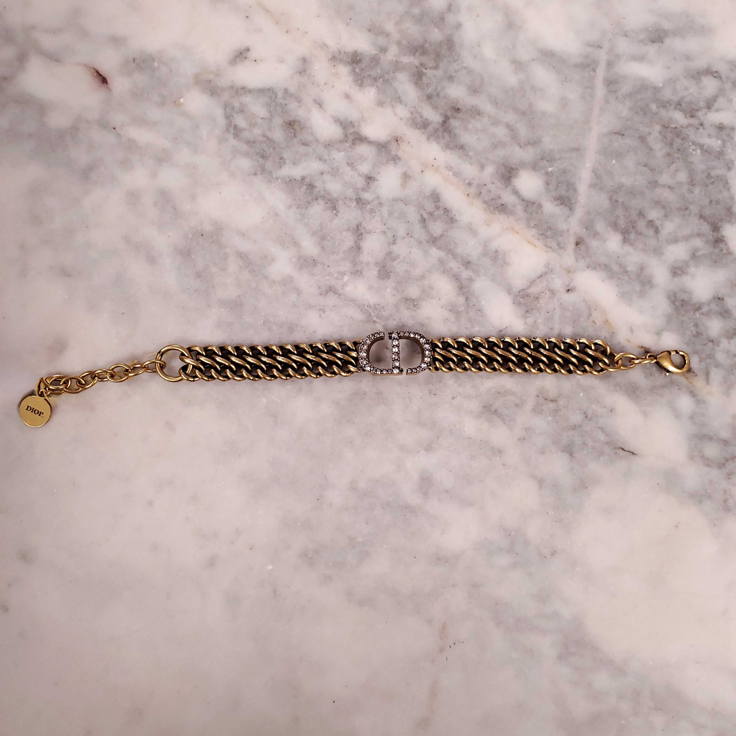 CHRISTIAN DIOR GOLD BRACELET AND EARRINGS SET WITH DIAMANTE CD DETAIL