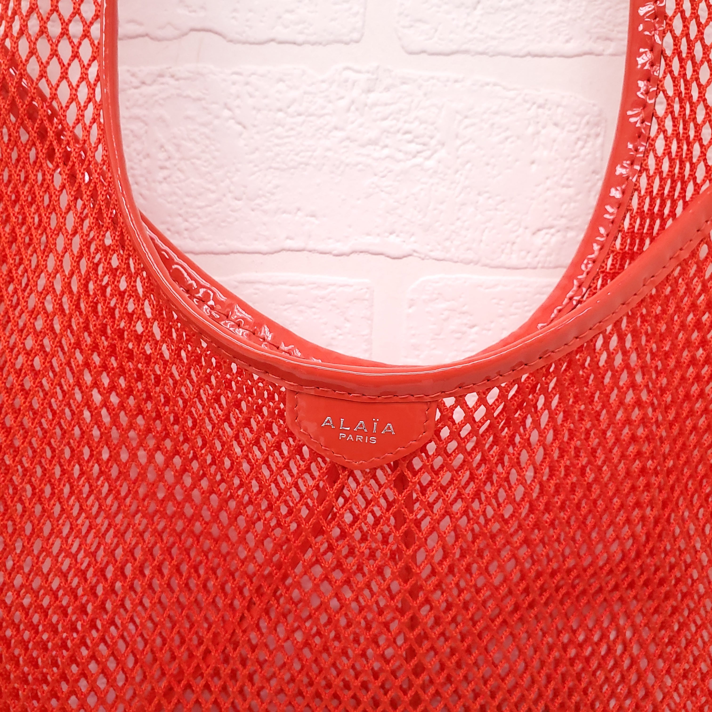 ALAÏA ONE PIECE MEDIUM MESH TOTE BAG IN RED