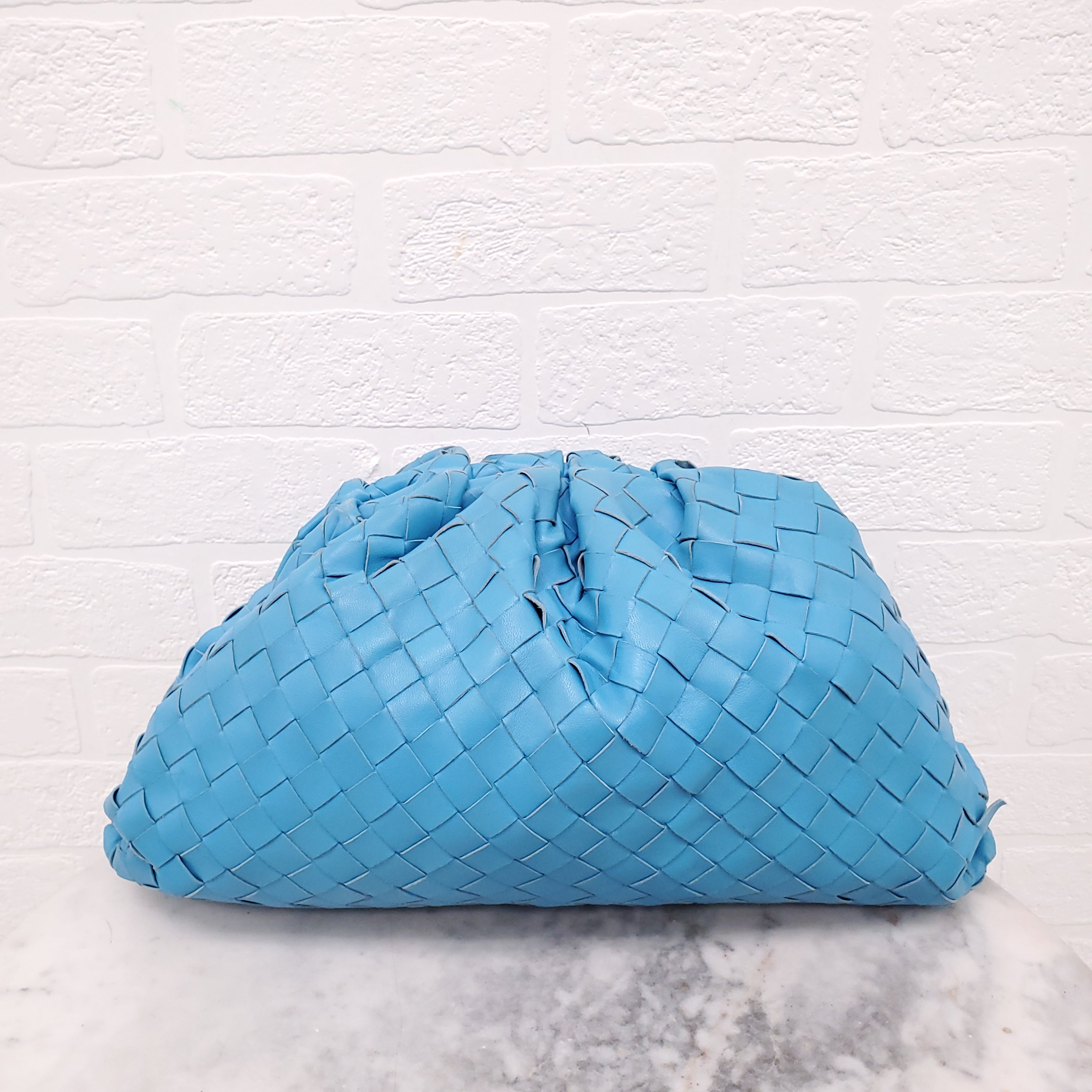 BOTTEGA VENETA INTRECCIATO CLUTCH IN BLUE LEATHER