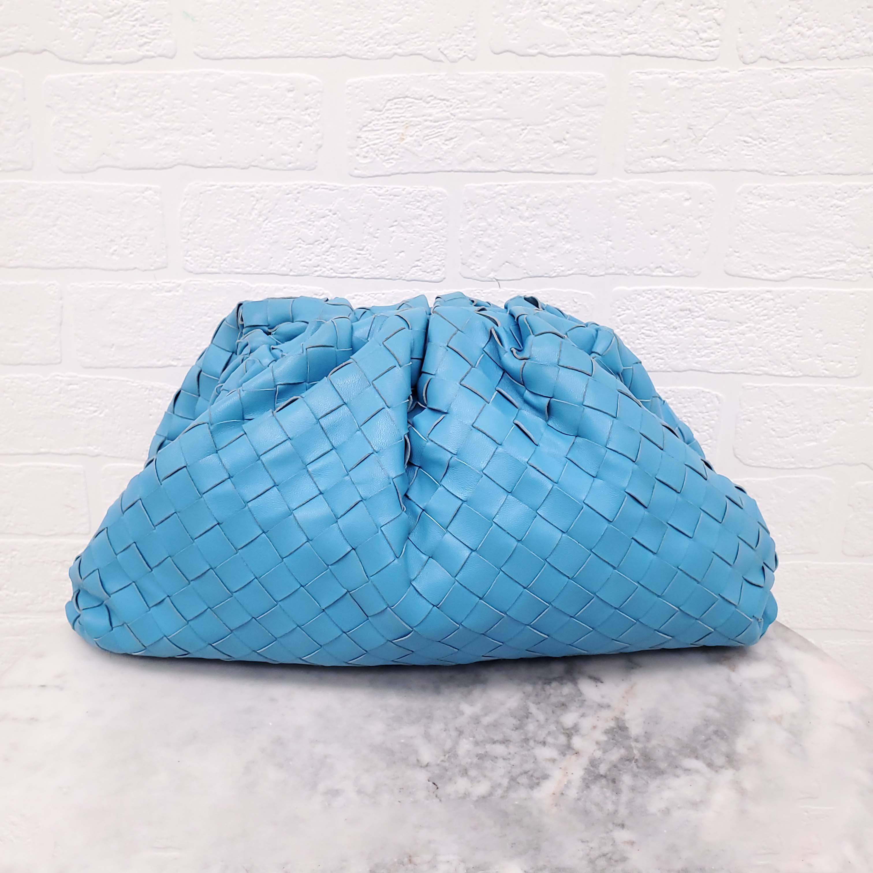 BOTTEGA VENETA INTRECCIATO CLUTCH IN BLUE LEATHER