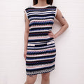 CHANEL BLUE, RED, CREAM AND BLACK TWEED SKIRT SET WITH LOGO DETAIL - SIZE 38