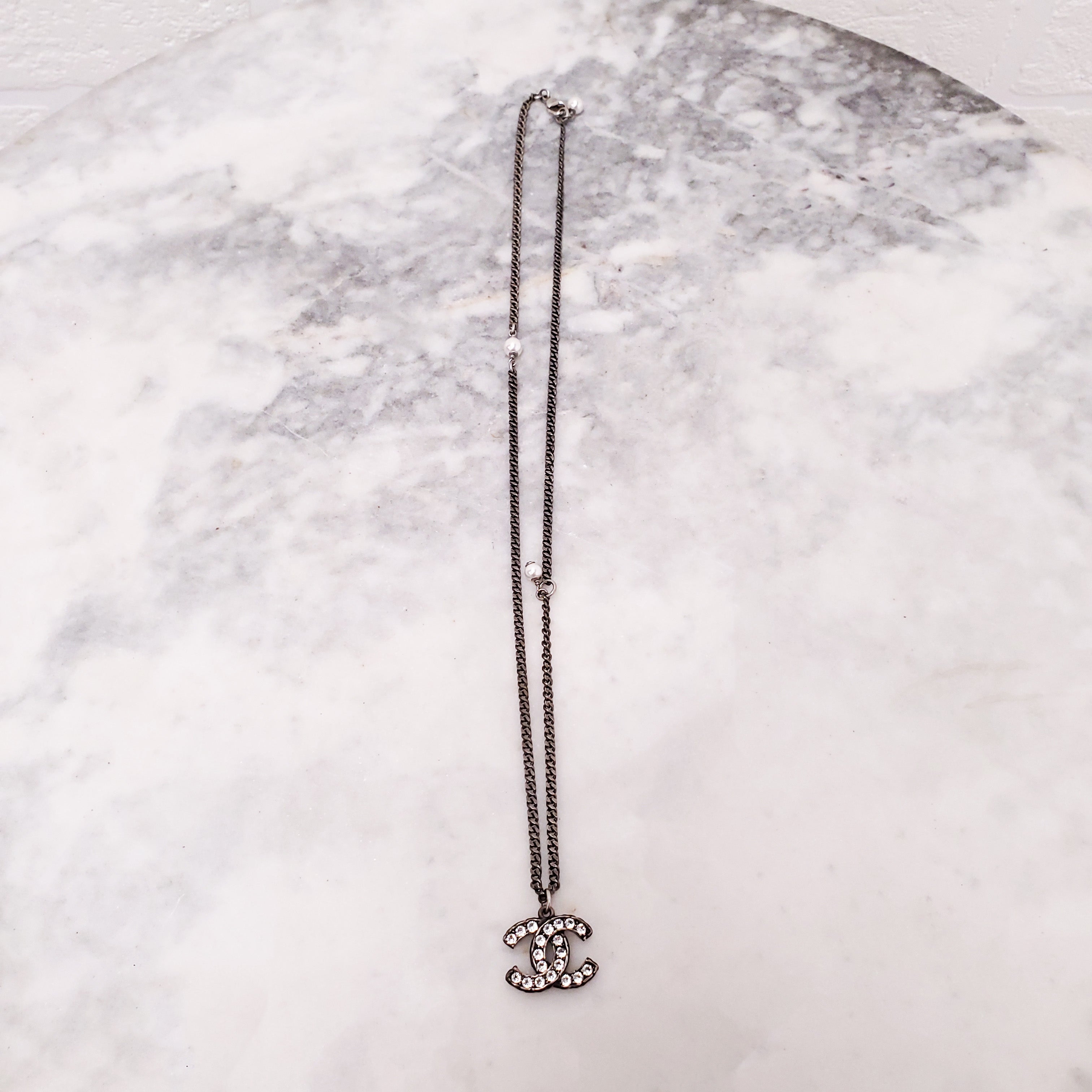 CHANEL CHROME CRYSTAL AND PEARL LOGO ADJUSTABLE NECKLACE