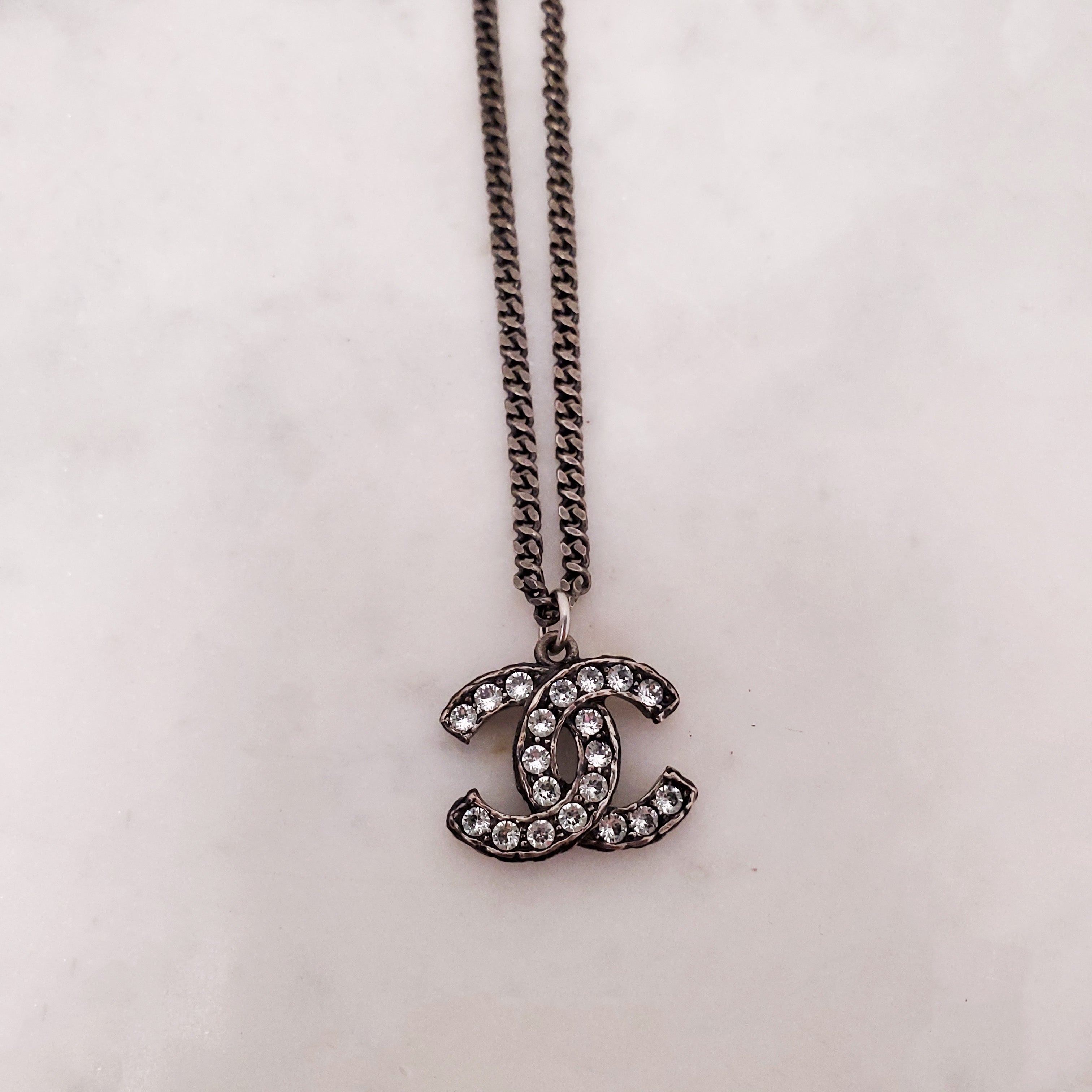 CHANEL CHROME CRYSTAL AND PEARL LOGO ADJUSTABLE NECKLACE