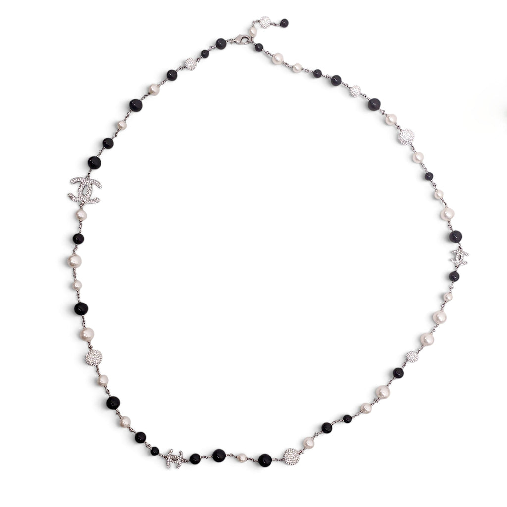 CHANEL PEARL CREAM AND BLACK NECKLACE WITH CRYSTAL DETAIL
