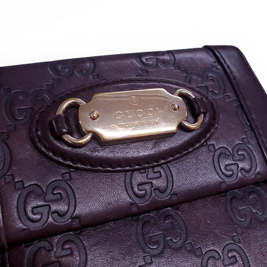 GUCCI BROWN LEATHER MONOGRAM EMBOSSED WALLET