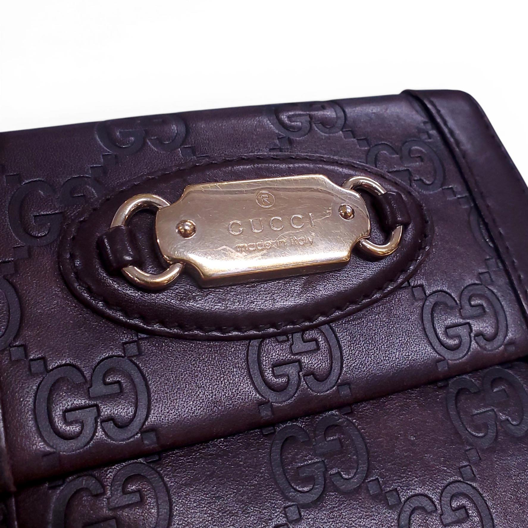 GUCCI BROWN LEATHER MONOGRAM EMBOSSED WALLET
