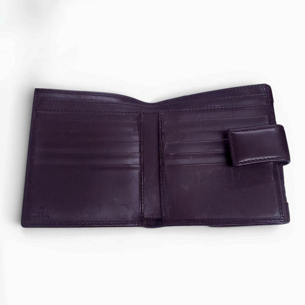 GUCCI BROWN LEATHER MONOGRAM EMBOSSED WALLET