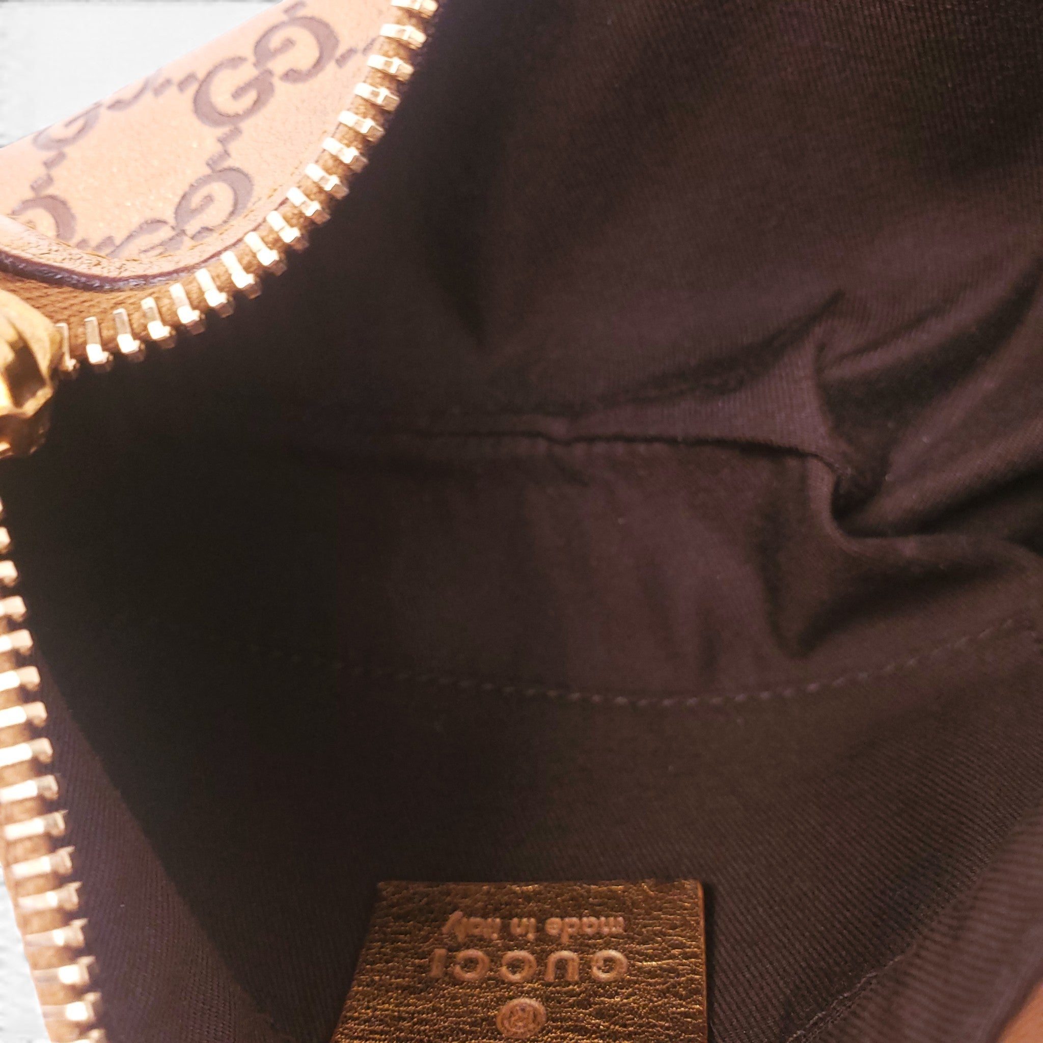 GUCCI GOLD MONOGRAM POUCHETTE BAG