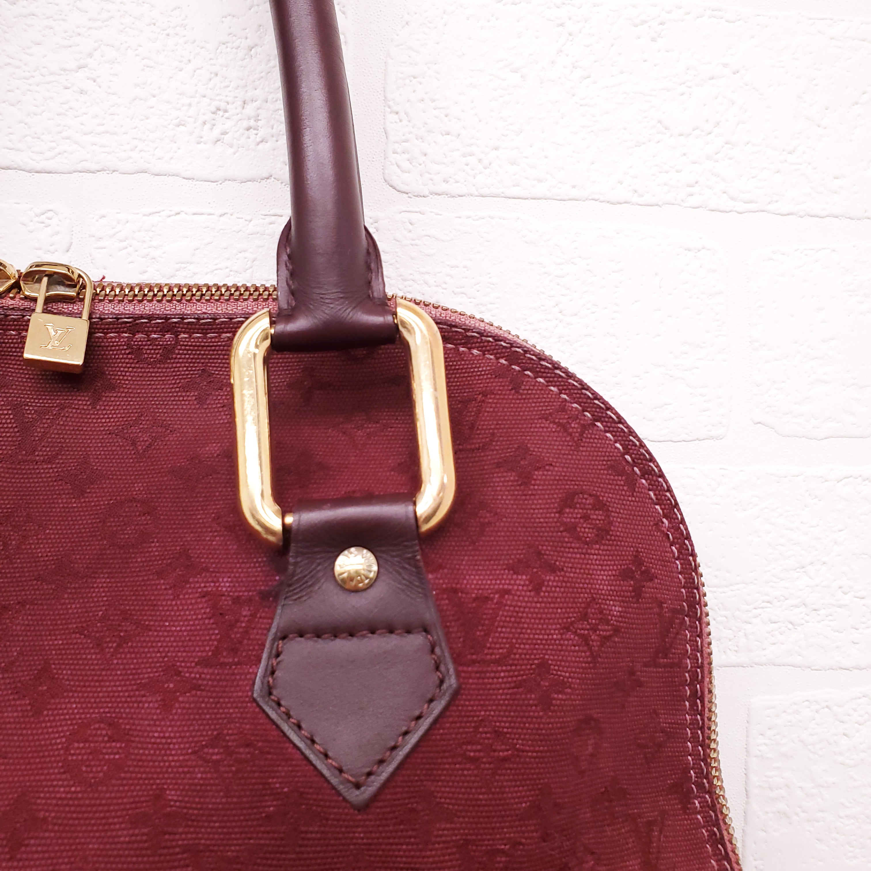 LOUIS VUITTON VINTAGE BURGUNDY MONOGRAM 'ALMA' BAG