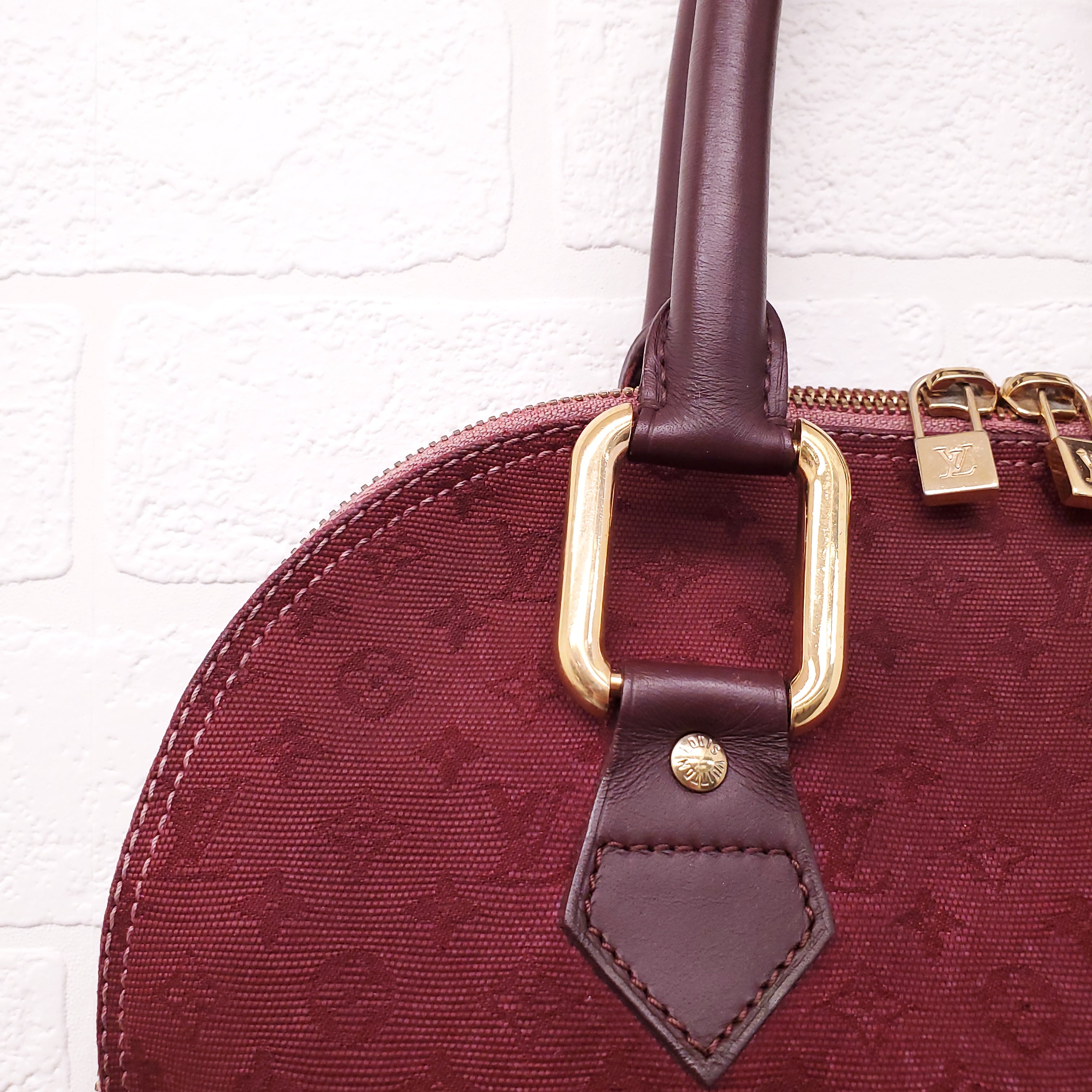 LOUIS VUITTON VINTAGE BURGUNDY MONOGRAM 'ALMA' BAG