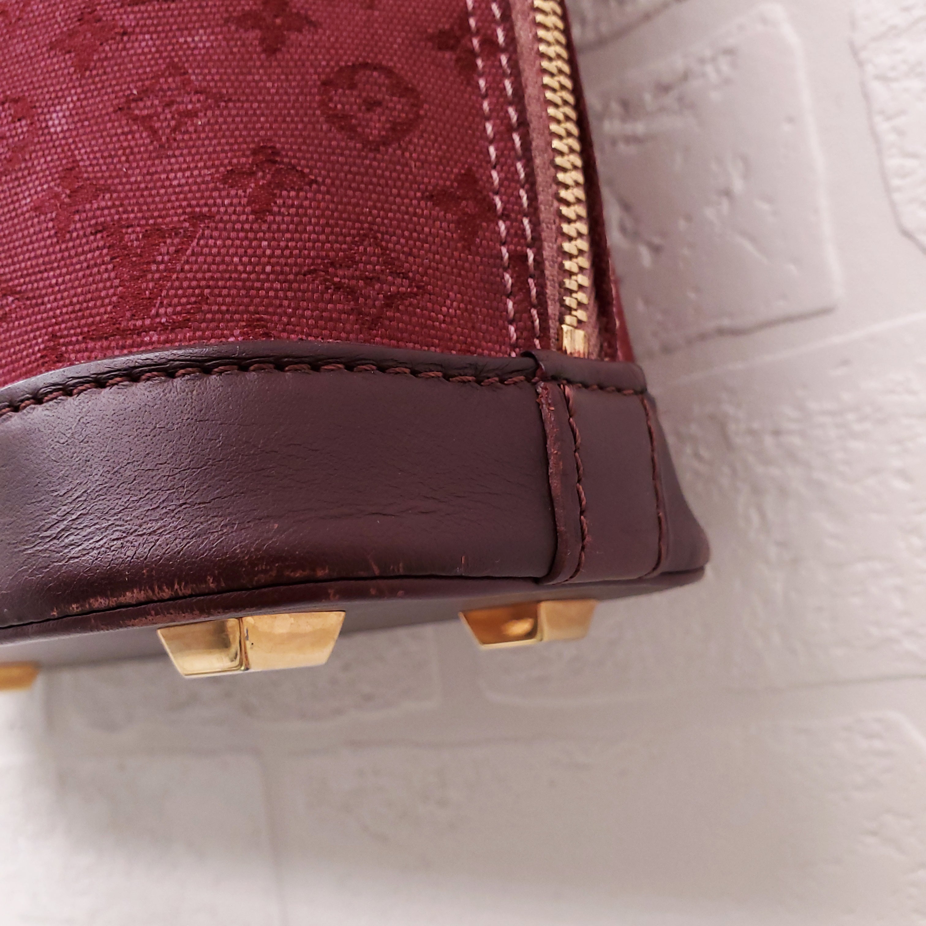 LOUIS VUITTON VINTAGE BURGUNDY MONOGRAM 'ALMA' BAG