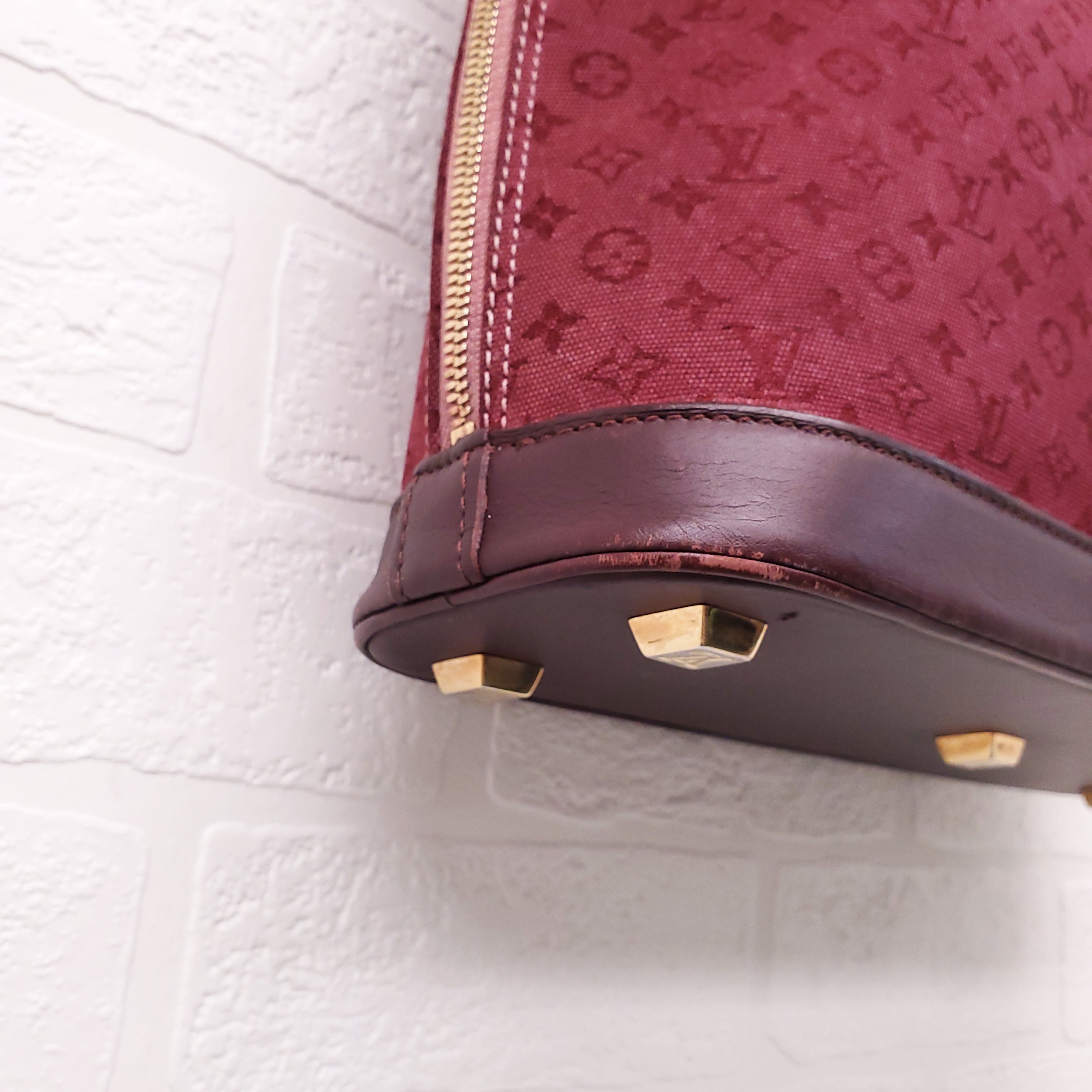 LOUIS VUITTON VINTAGE BURGUNDY MONOGRAM 'ALMA' BAG