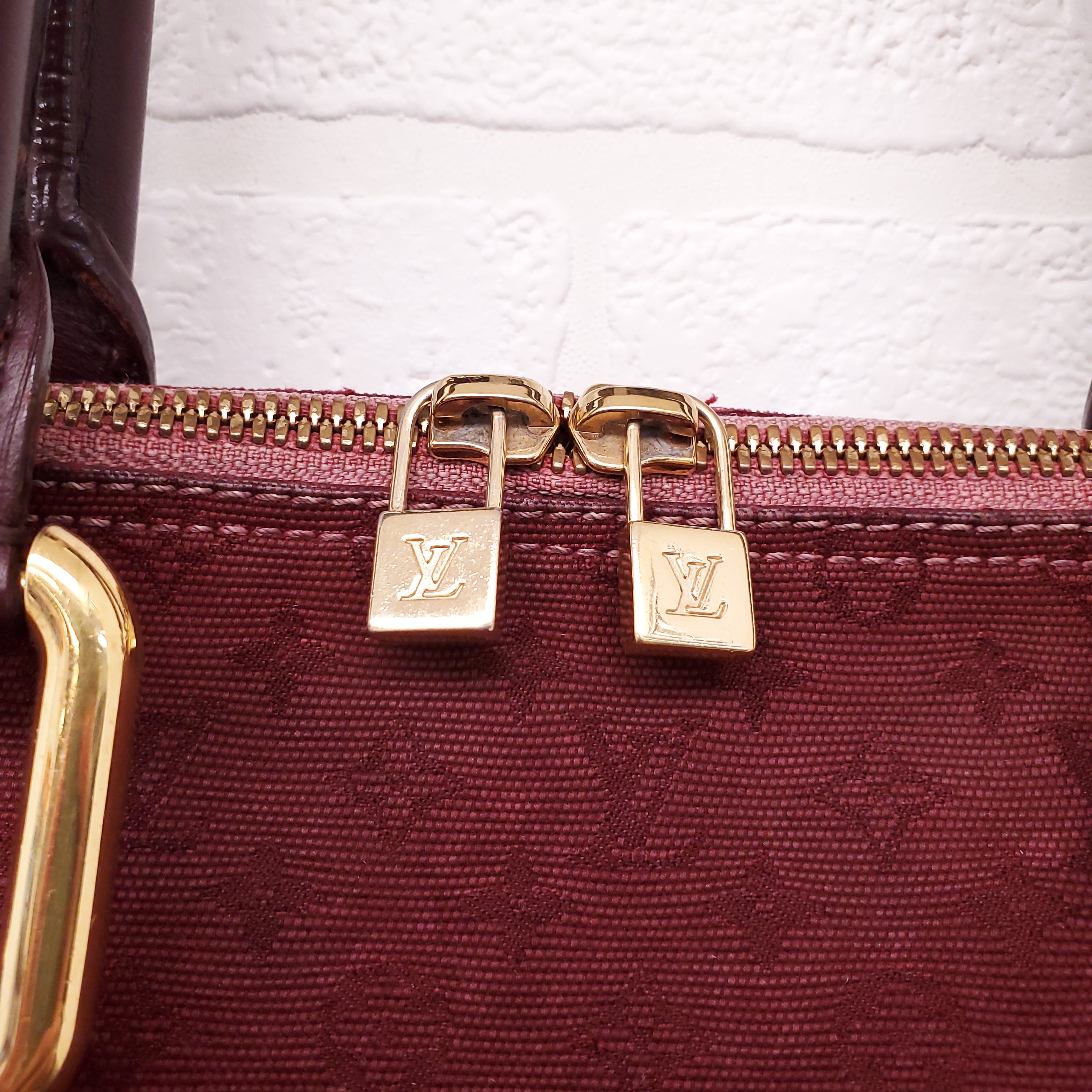 LOUIS VUITTON VINTAGE BURGUNDY MONOGRAM 'ALMA' BAG