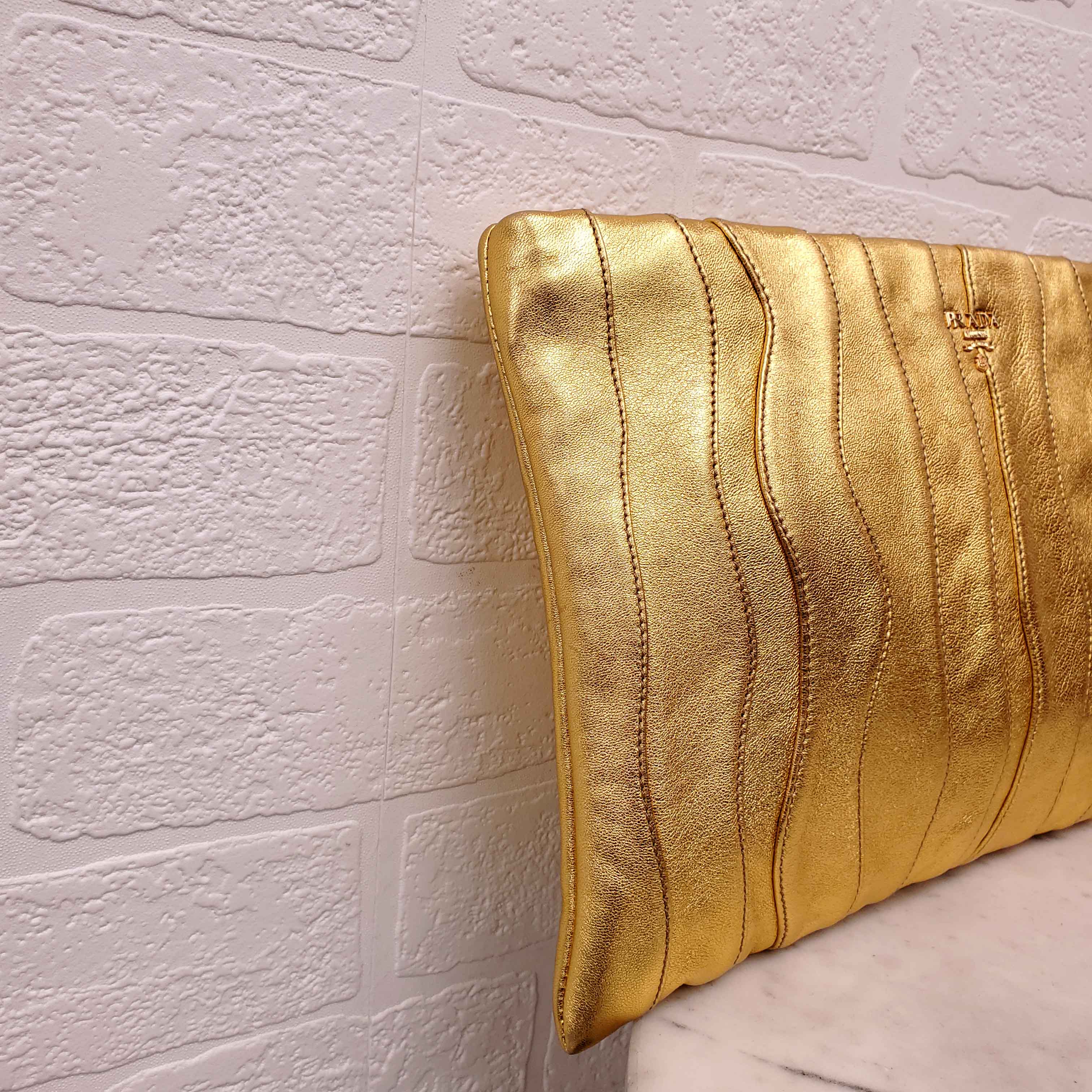 PRADA GOLD NAPA WAVE CLUTCH