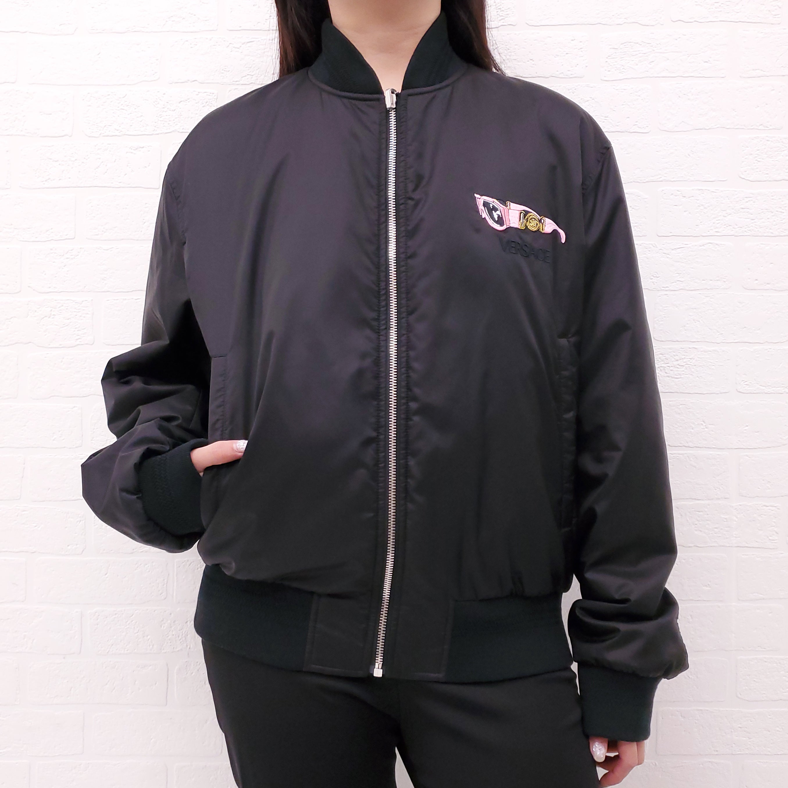 VERSACE BLACK REVERSIBLE BOMBER JACKET WITH SUNGLASSES DETAIL - SIZE 50