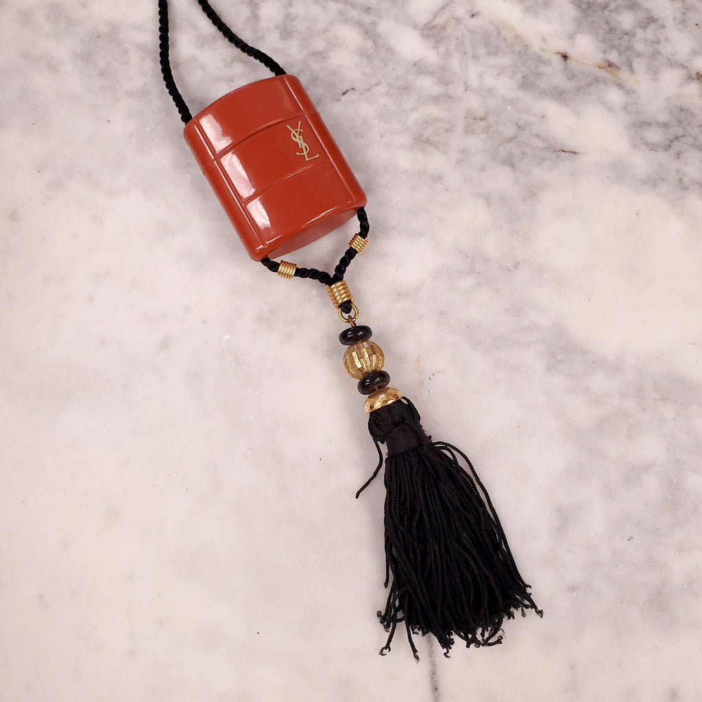 YVES SAINT LAURENT 1970 PLASTIC PENDANT NECKLACE WITH TASSEL ON ROPE