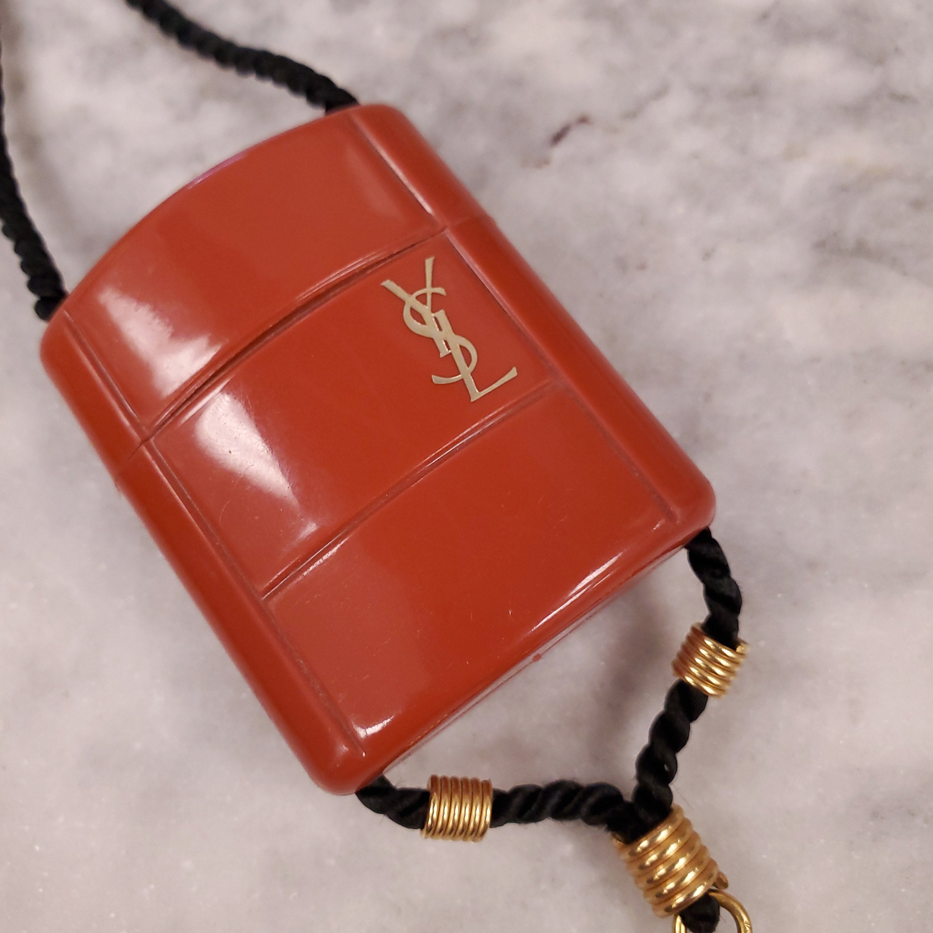 YVES SAINT LAURENT 1970 PLASTIC PENDANT NECKLACE WITH TASSEL ON ROPE