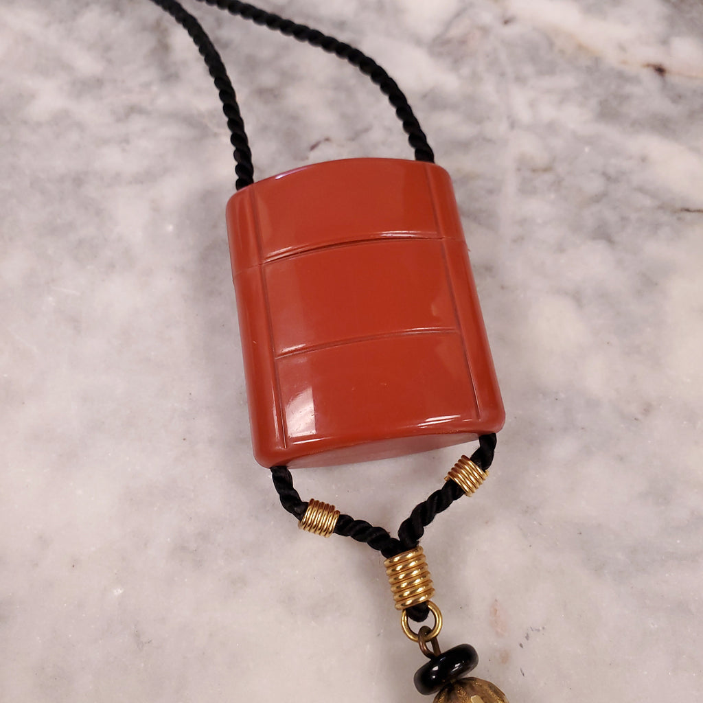 YVES SAINT LAURENT 1970 PLASTIC PENDANT NECKLACE WITH TASSEL ON ROPE