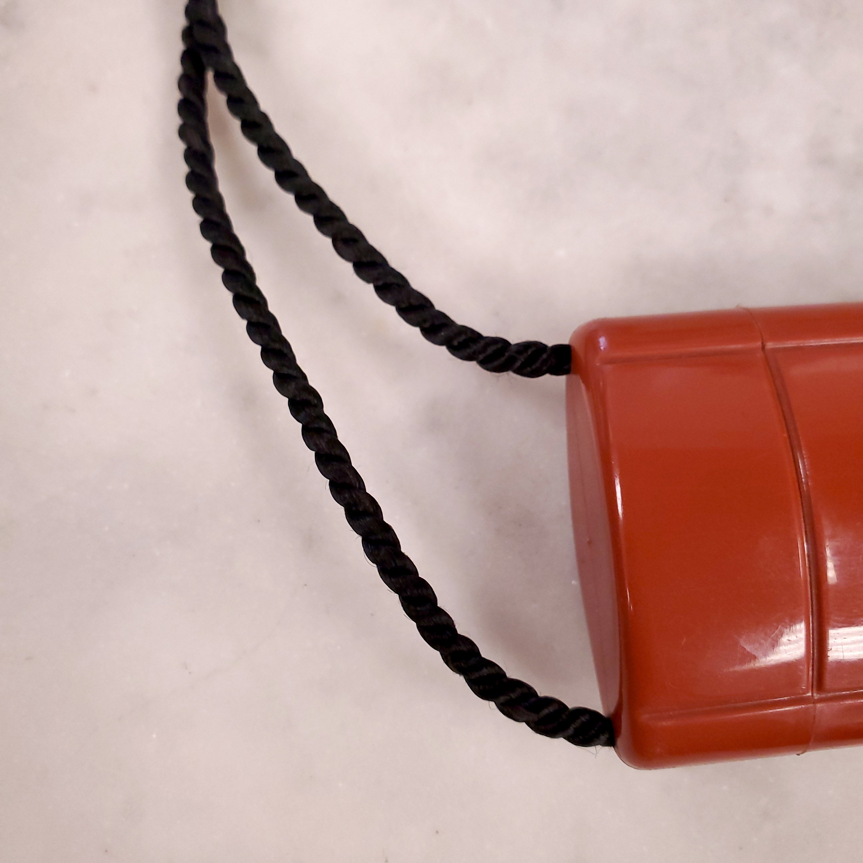 YVES SAINT LAURENT 1970 PLASTIC PENDANT NECKLACE WITH TASSEL ON ROPE