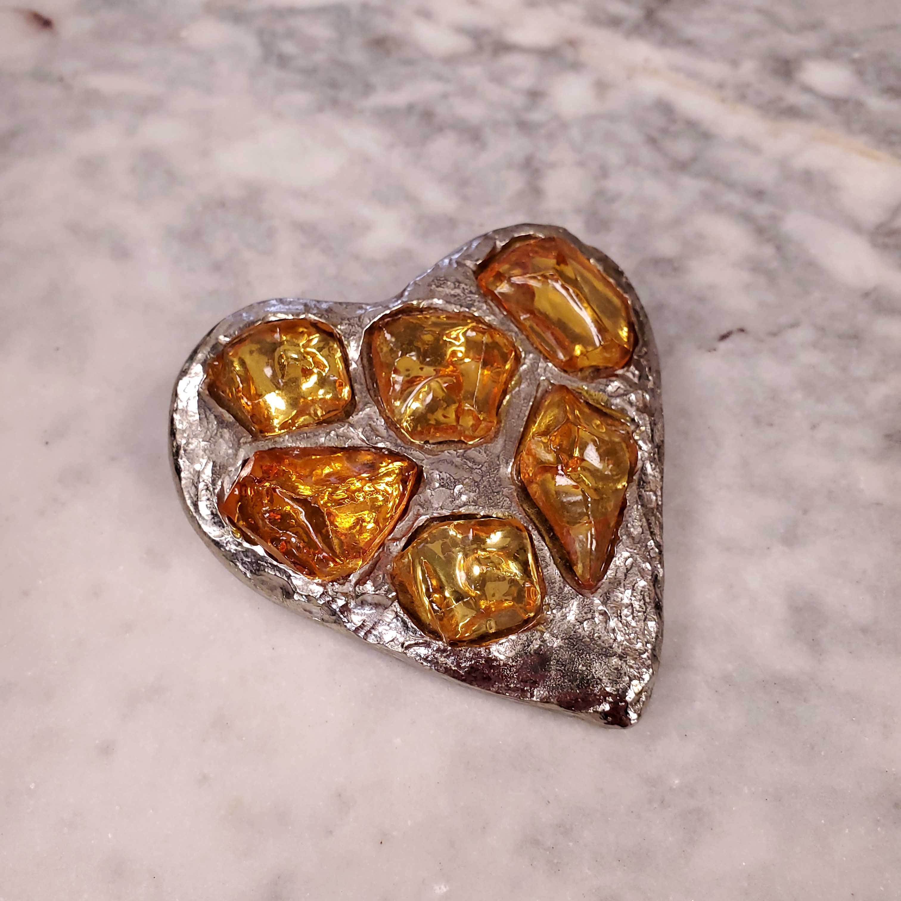 YVES SAINT LAURENT METAL TEXTURED HEART PIN WITH YELLOW STONES